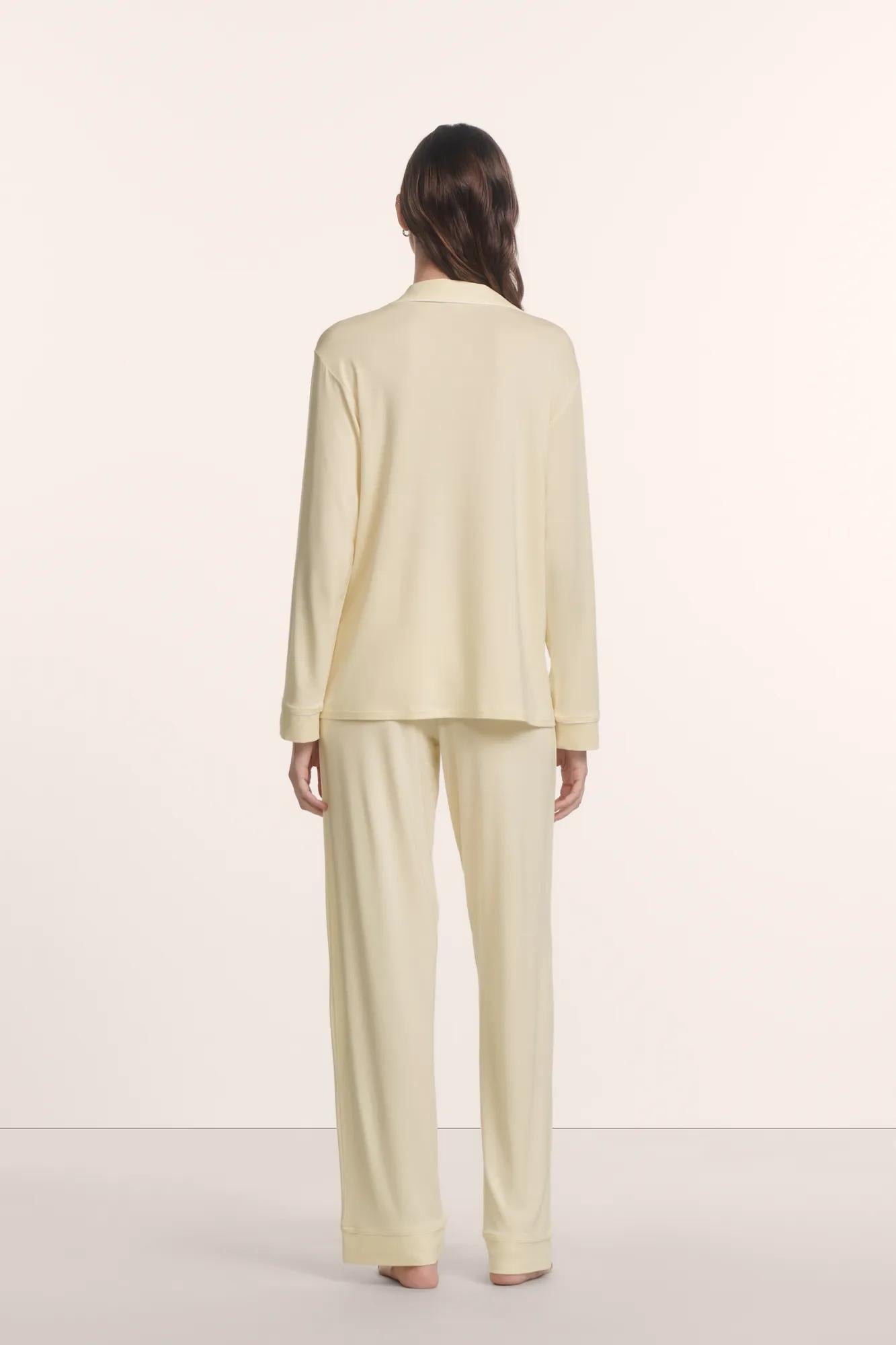 Model is wearing Gisele TENCEL™ Modal Long PJ Set in Buttercream/Ivory