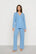 Model is wearing Gisele TENCEL™ Modal Long PJ Set in Summer Blue/White