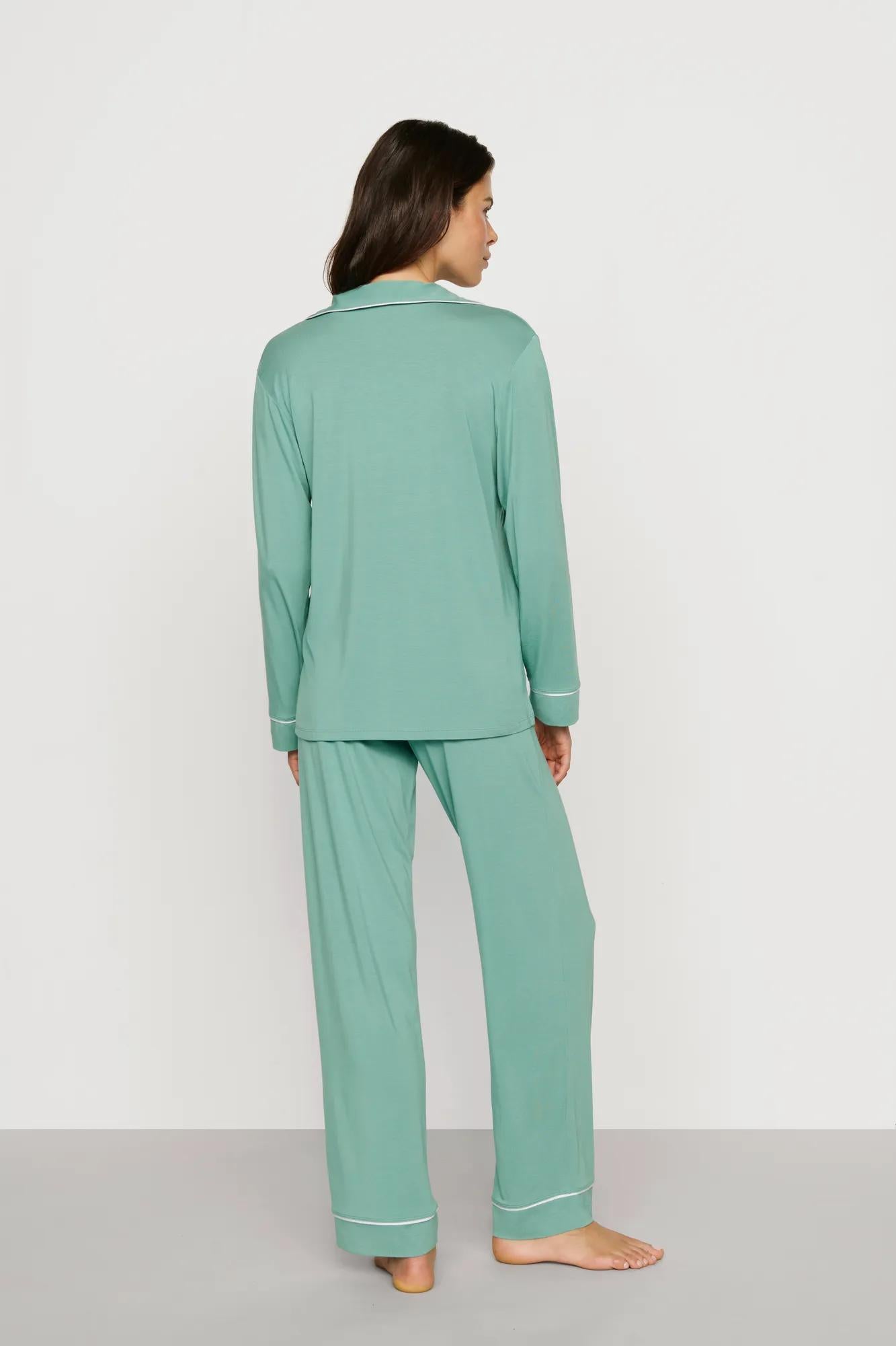Model is wearing Gisele TENCEL™ Modal Long PJ Set in Seagrass/White