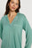 Model is wearing Gisele TENCEL™ Modal Long PJ Set in Seagrass/White