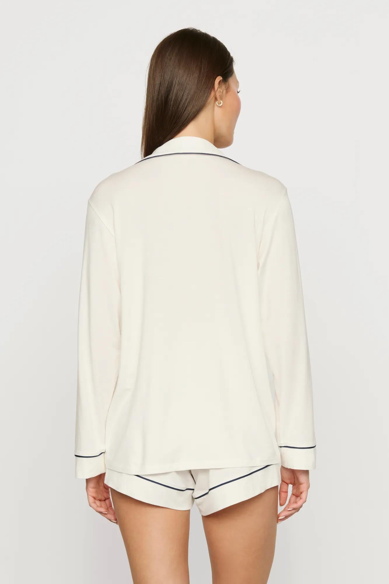 Model is wearing Gisele TENCEL™ Modal Long Sleeve Short PJ Set in Ivory/Navy