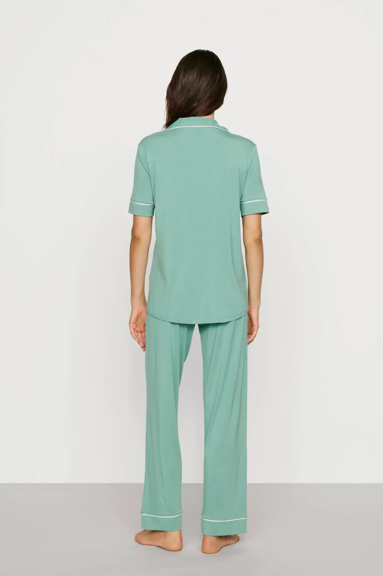 Model is wearing Gisele TENCEL™ Modal Short Sleeve & Pant PJ Set in Seagrass/White