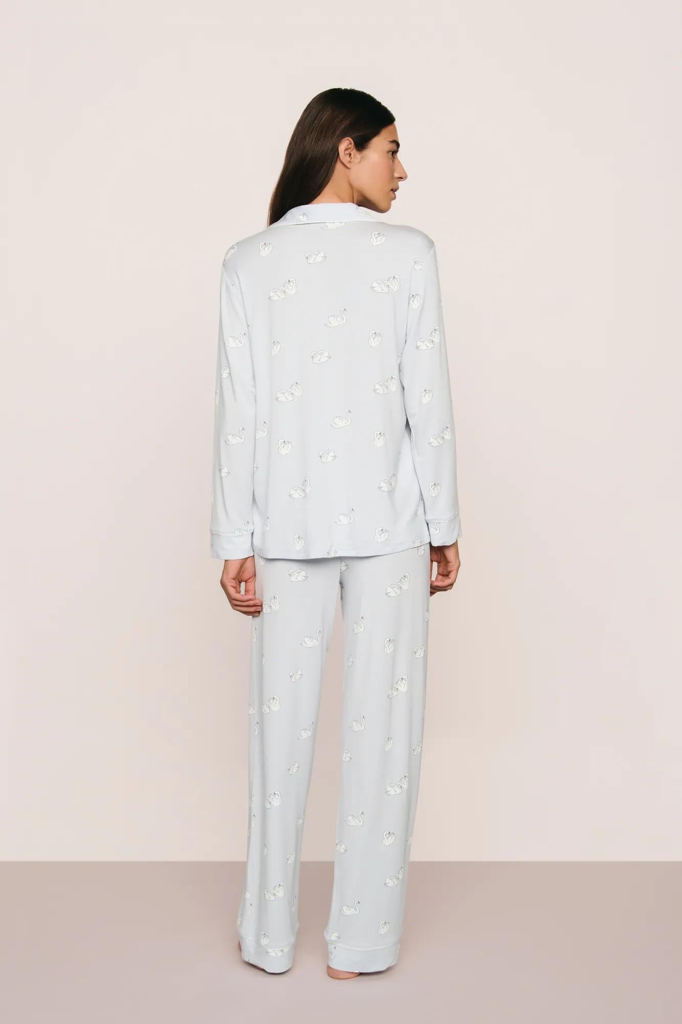 Model is wearing Gisele Printed TENCEL™ Modal Long PJ Set in Large Swans Ice Blue/Ivory