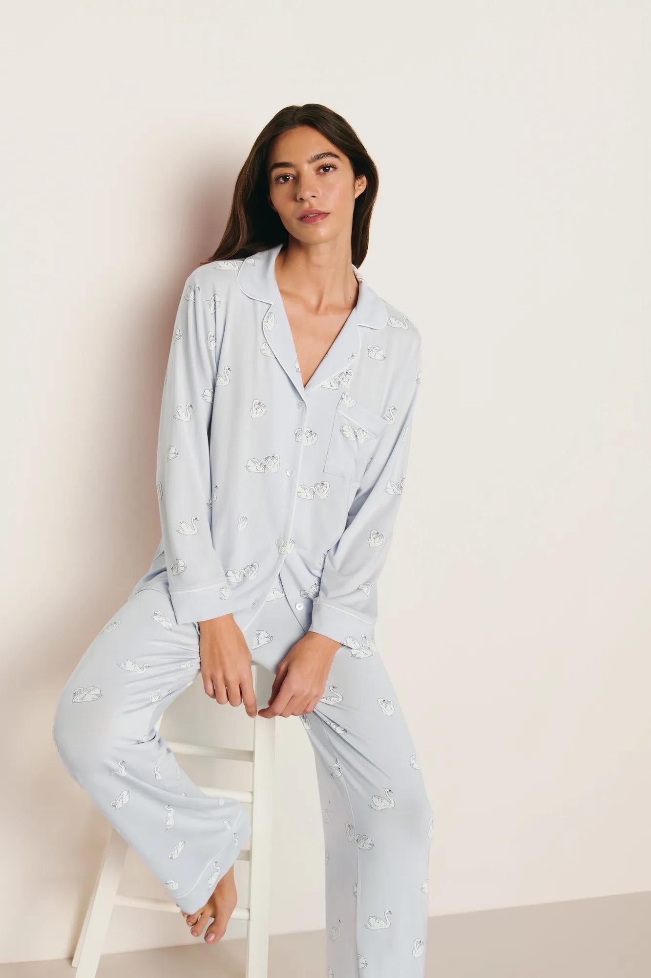 Model is wearing Gisele Printed TENCEL™ Modal Long PJ Set in Large Swans Ice Blue/Ivory