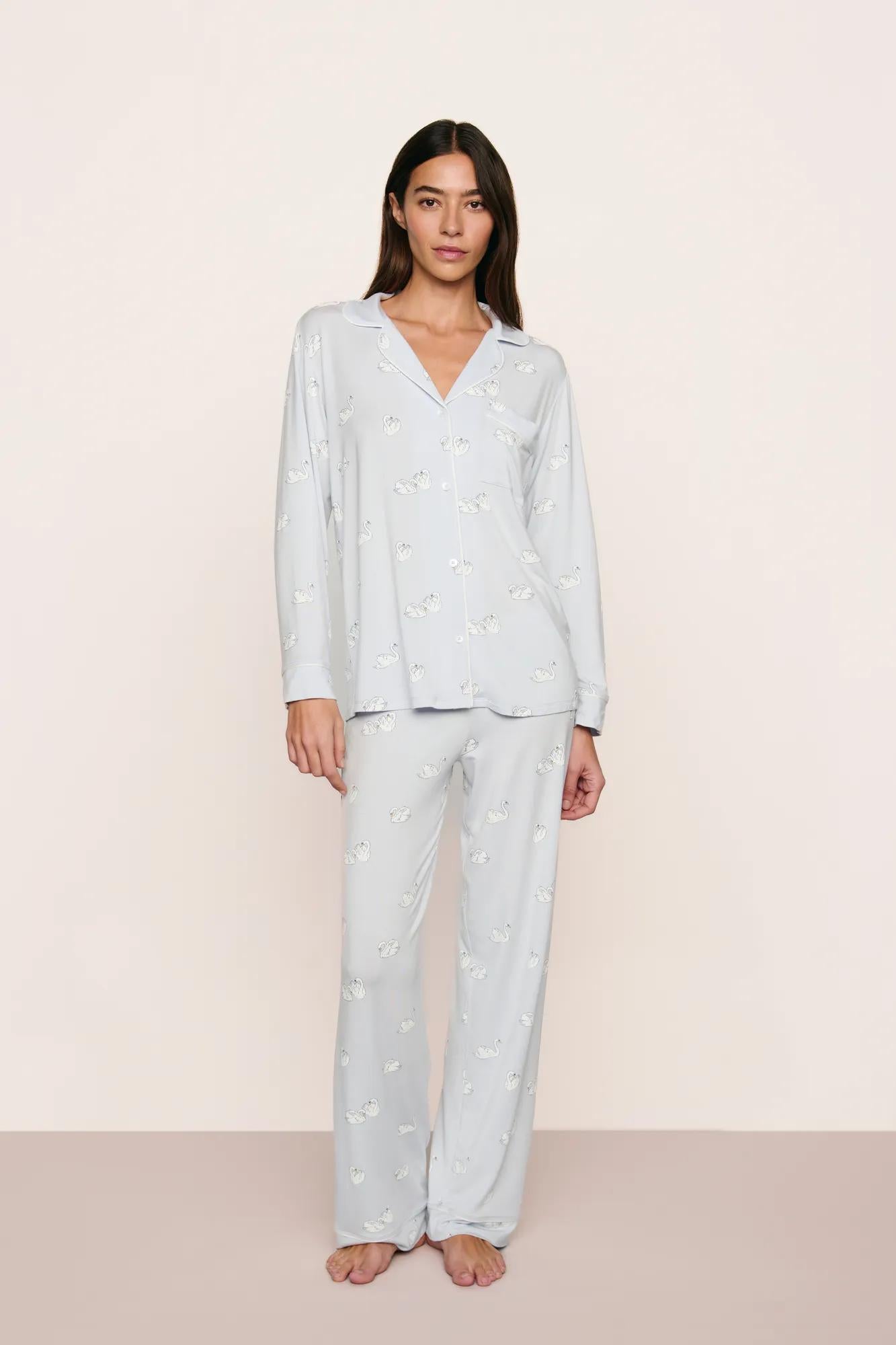 Model is wearing Gisele Printed TENCEL™ Modal Long PJ Set in Large Swans Ice Blue/Ivory