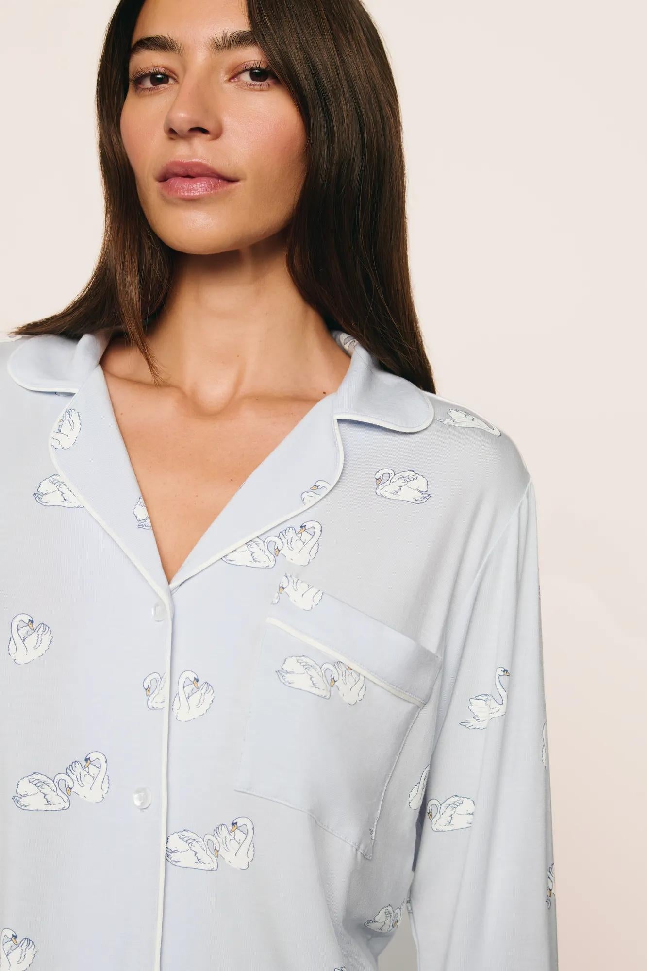Model is wearing Gisele Printed TENCEL™ Modal Long PJ Set in Large Swans Ice Blue/Ivory