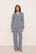 Model is wearing Gisele Printed TENCEL™ Modal Long PJ Set  in Seashell Navy/Navy