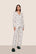 Model is wearing Gisele Printed TENCEL™ Modal Long PJ Set  in Ski Chalet Ivory/Pine
