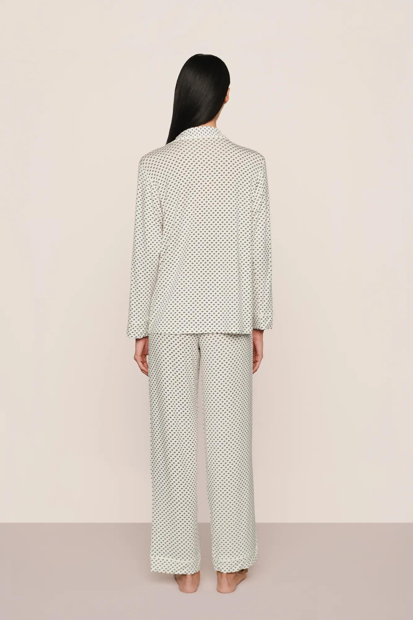 Model is wearing Gisele Printed TENCEL™ Modal Long PJ Set in Tide Dot Ivory/Ivory