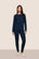 Model is wearing Gisele Printed TENCEL™ Modal Crewneck PJ Set  in Forest Pine Navy/Ivory