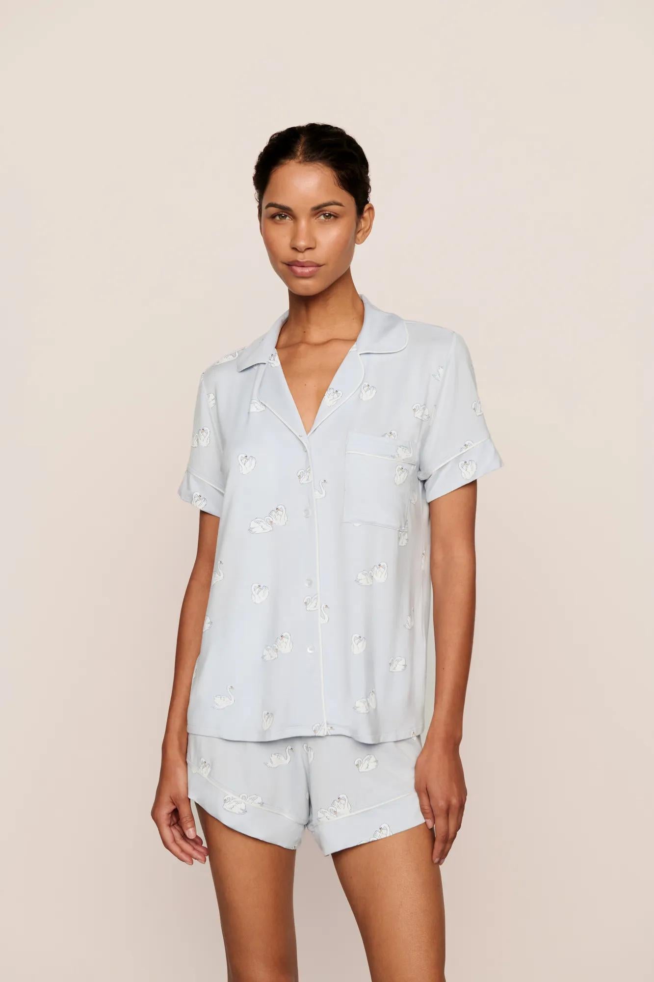 Model is wearing Gisele Printed TENCEL™ Modal Relaxed Short PJ Set in Large Swans Ice Blue/Ivory
