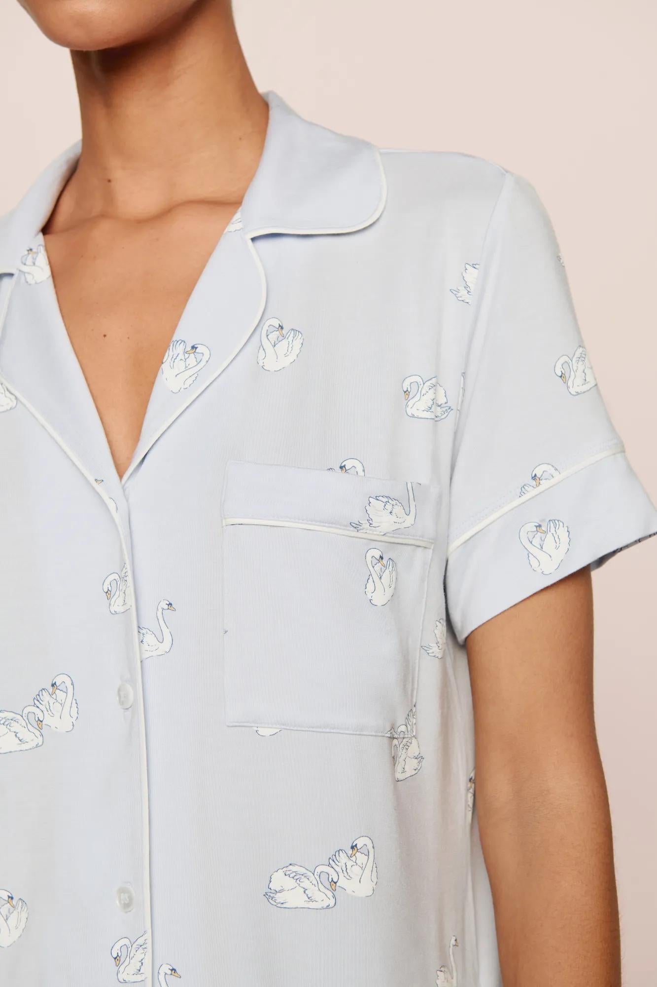 Model is wearing Gisele Printed TENCEL™ Modal Relaxed Short PJ Set in Large Swans Ice Blue/Ivory