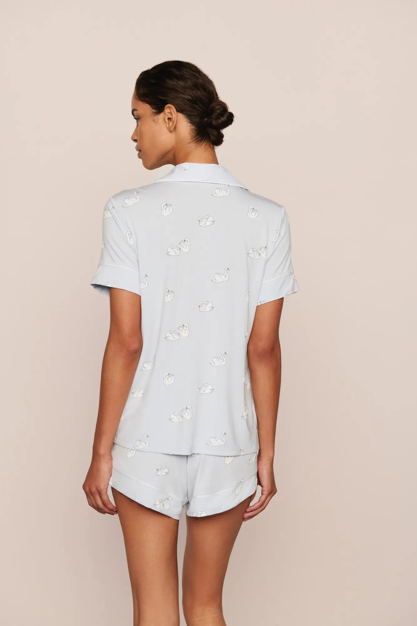 Model is wearing Gisele Printed TENCEL™ Modal Relaxed Short PJ Set in Large Swans Ice Blue/Ivory