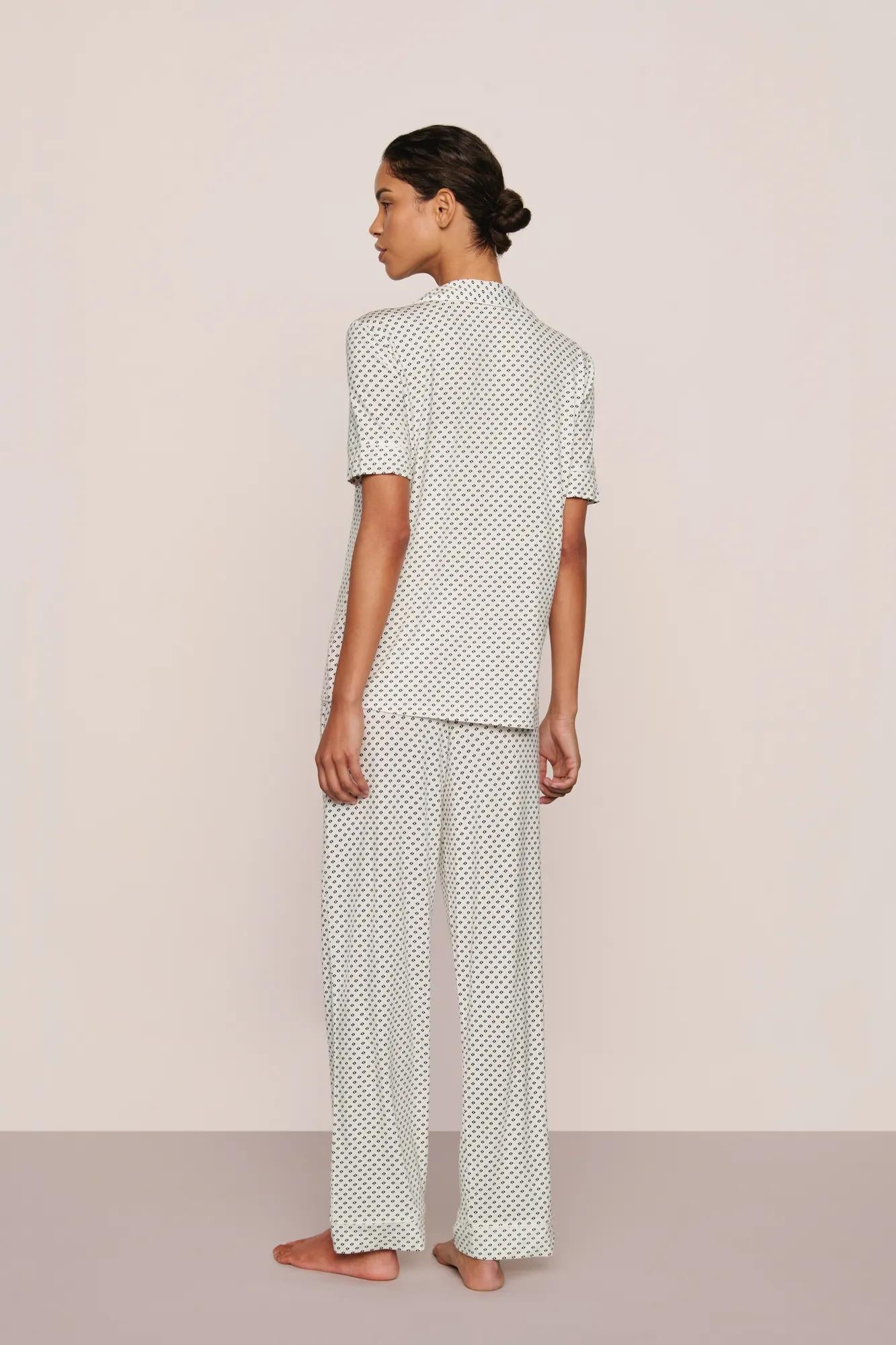Model is wearing Gisele Printed TENCEL™ Modal Short Sleeve Pant PJ Set in Tide Dot Ivory/Ivory