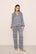 Model is wearing Inez Washable Silk Printed Long PJ Set in Azulejos Navy/Navy