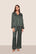 Model is wearing Inez Washable Silk Printed Long PJ Set  in Classic Stripe Pine/Ivory