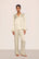 Model is wearing Inez Washable Silk Printed Long PJ Set in Foliage Mint Cream/Ivory