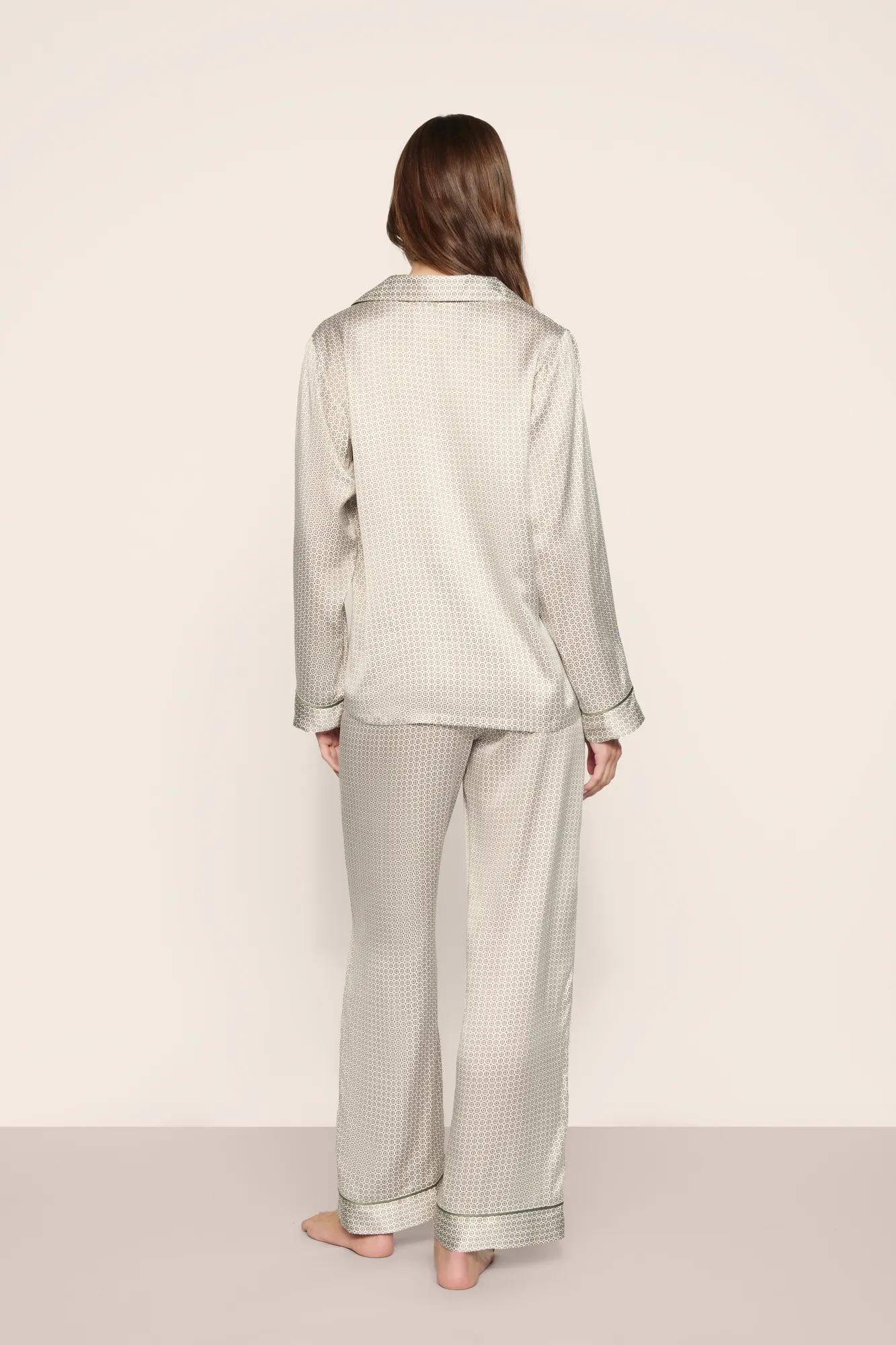 Model is wearing Inez Washable Silk Printed Long PJ Set  in  Geo Mod Desert Sage/Desert Sag
