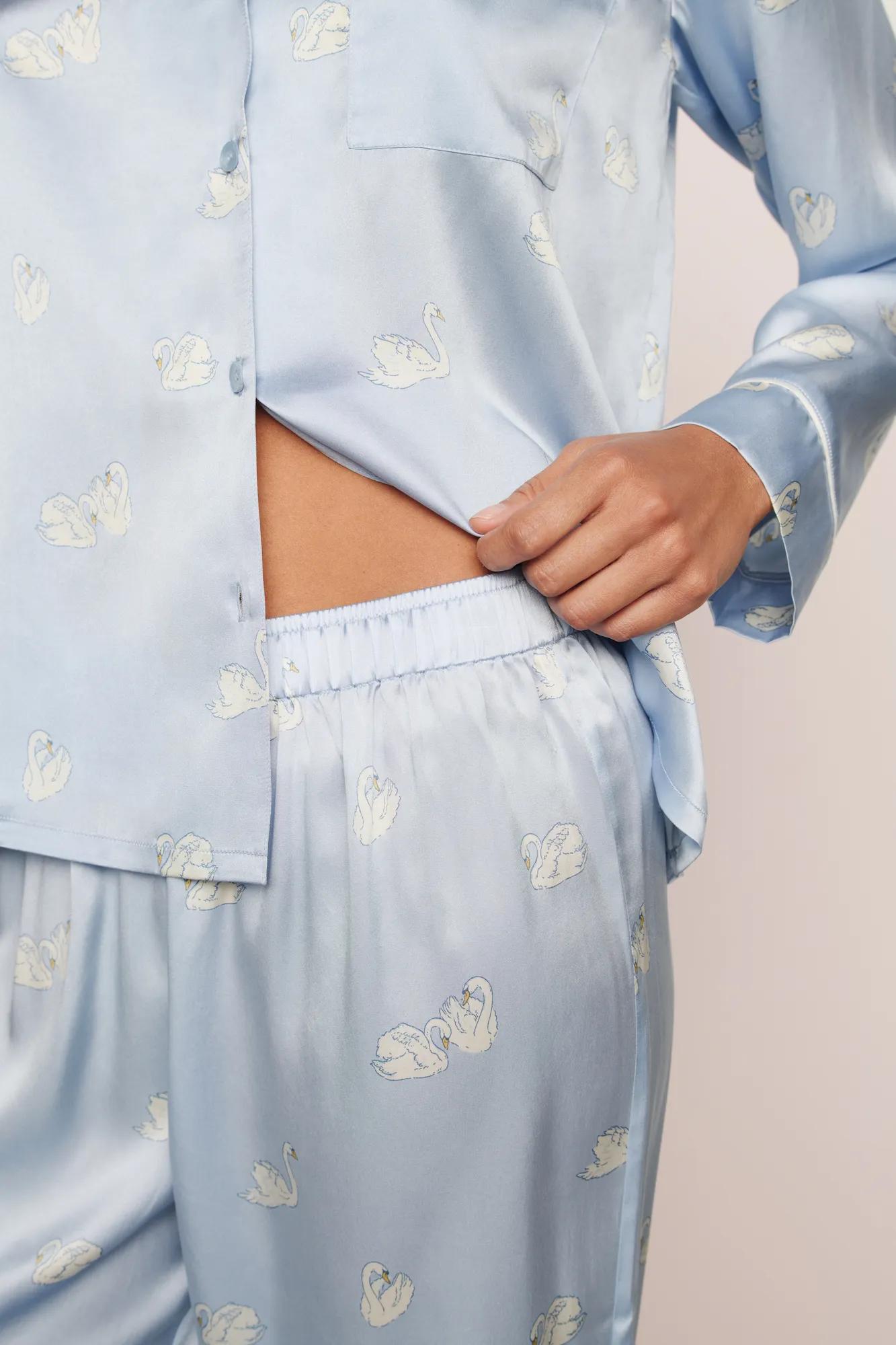 Model is wearing Inez Washable Silk Printed Long PJ Set in Large Swans Powder Blue/Ivory