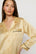 Model is wearing Inez Washable Silk Printed Long PJ Set in Stained Glass Sunbeam/Navy