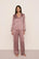 Model is wearing Inez Washable Silk Printed Long PJ Set in Tide Dot Fig/Ivory