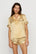 Model is wearing Inez Washable Silk Printed Short PJ Set in Stained Glass Sunbeam/Navy