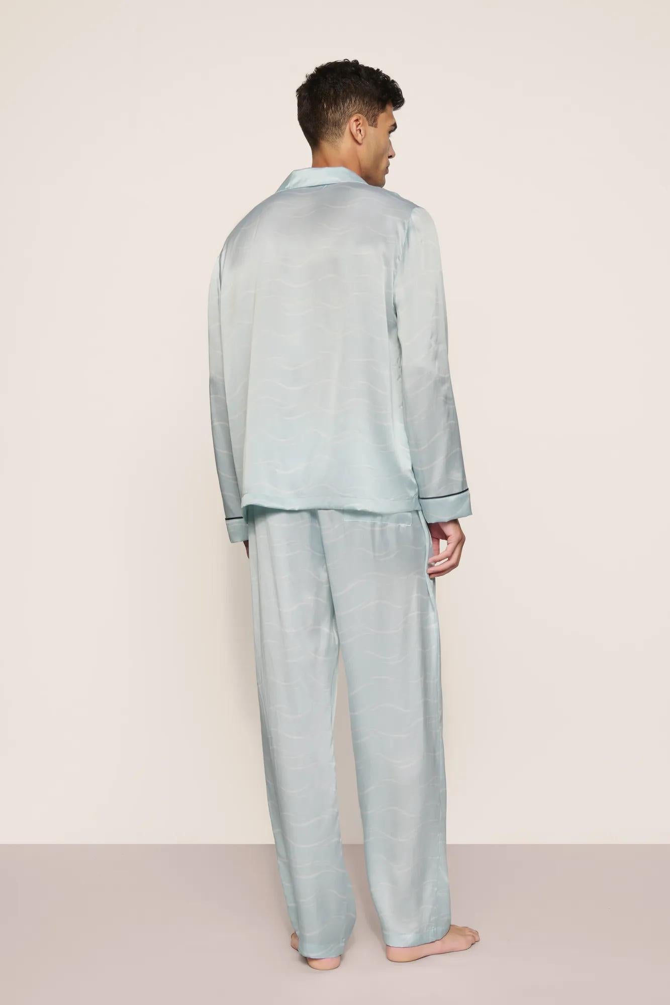 Model is wearing Charles Washable Silk Printed Long PJ Set in Waves Memorable Blue/Navy