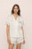 Model is wearing Inez Washable Silk Jacquard Short PJ Set in ClassicStripeJacquardPea/Na