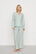 Model is wearing Nautico Long PJ Set in Regatta Stripe Seagrass/White
