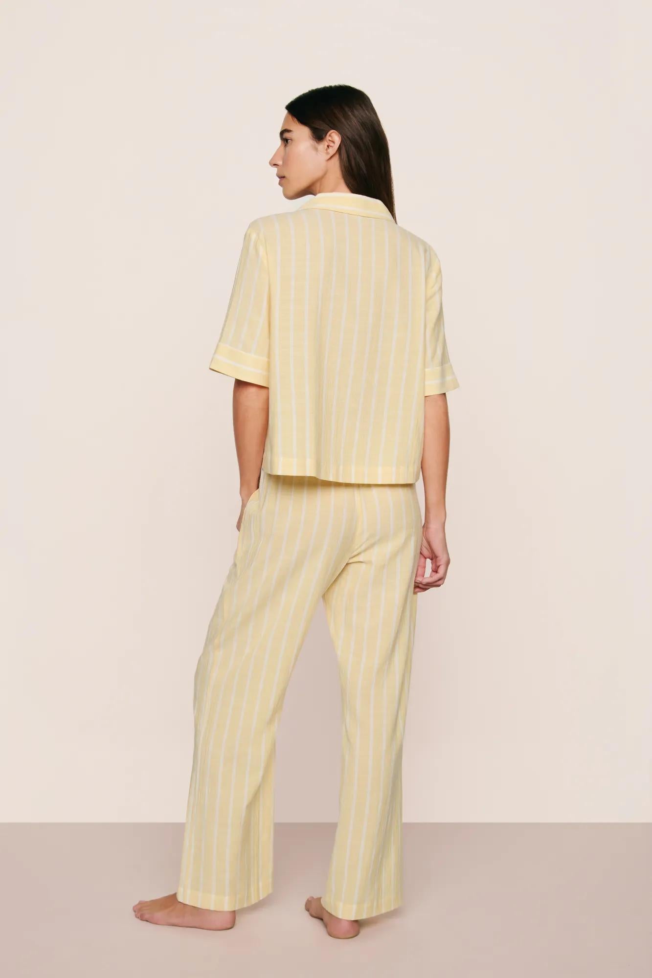Model is wearing Nautico Relaxed Short Sleeve & Pant PJ Set in Classic Stripe Sunbeam/Ivory
