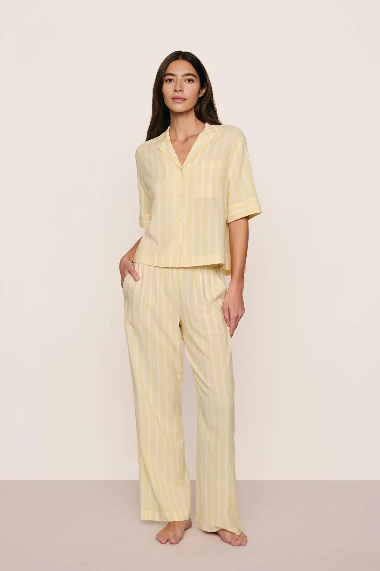 Model is wearing Nautico Relaxed Short Sleeve & Pant PJ Set in Classic Stripe Sunbeam/Ivory