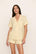 Model is wearing Nautico Shortie Short PJ Set in Classic Stripe Sunbeam/Ivory