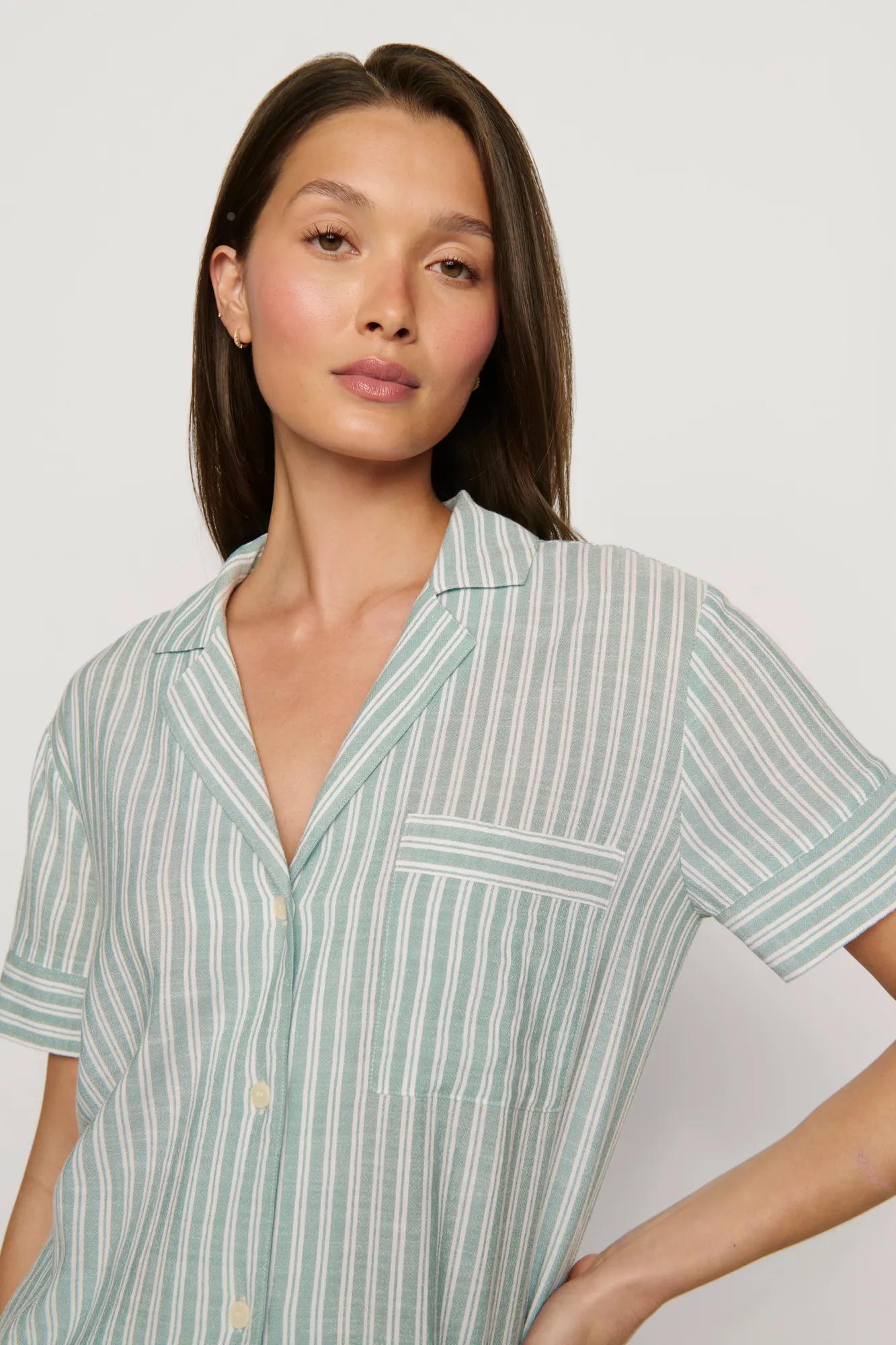 Model is wearing Nautico Shortie Short PJ Set in Regatta Stripe Seagrass/White
