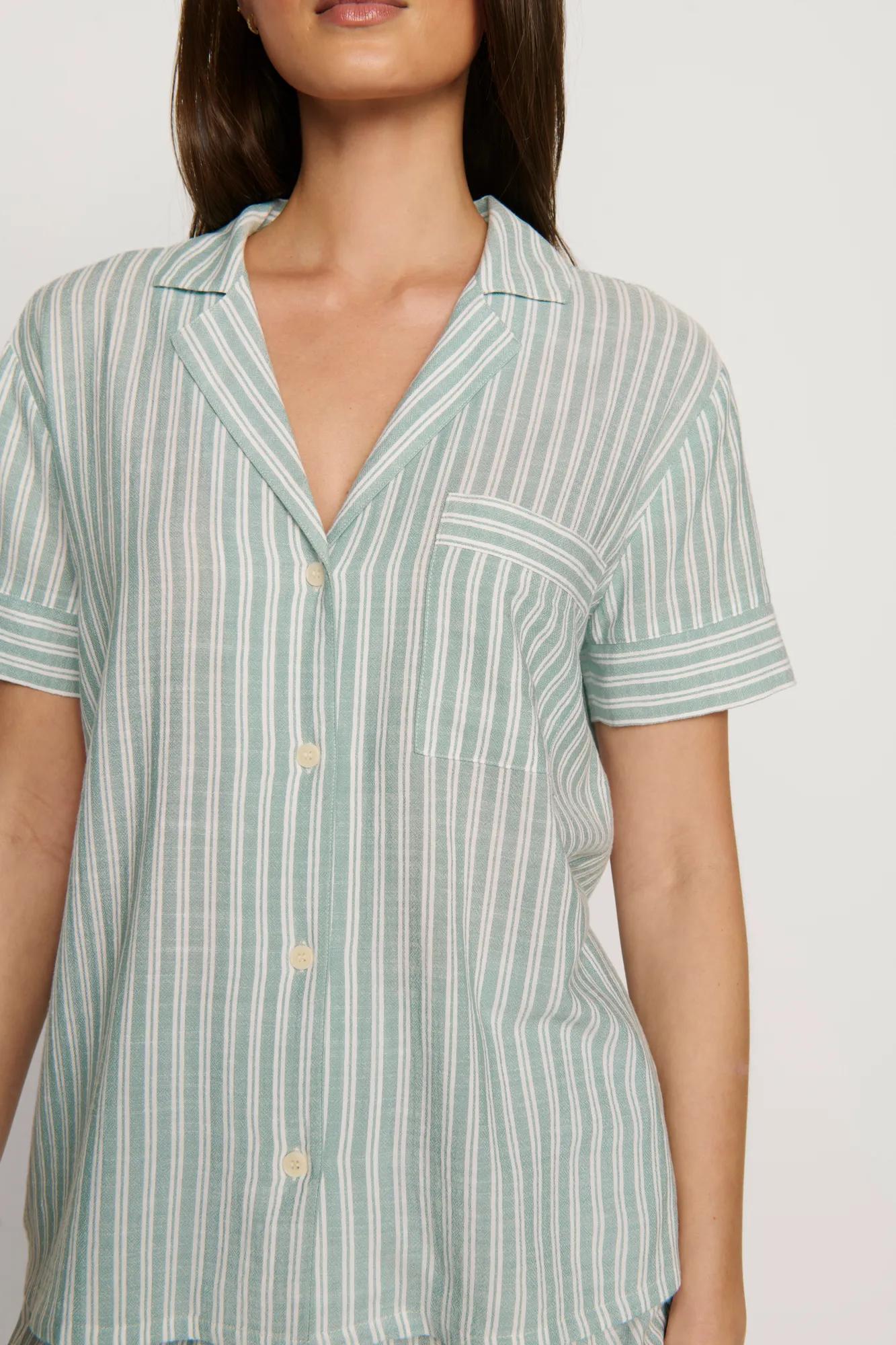 Model is wearing Nautico Shortie Short PJ Set in Regatta Stripe Seagrass/White