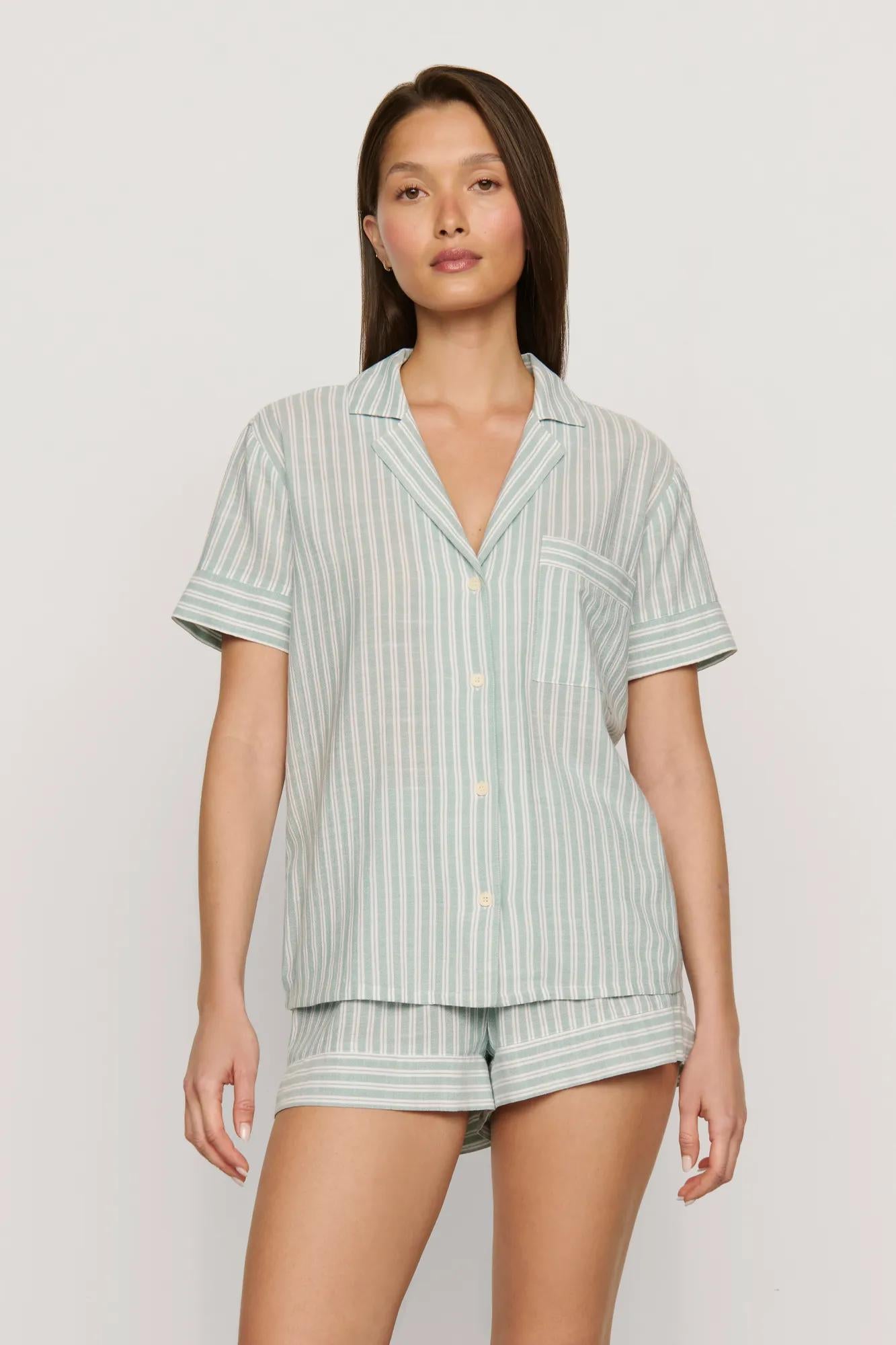 Model is wearing Nautico Shortie Short PJ Set in Regatta Stripe Seagrass/White