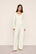 Model is wearing Pointelle Sweater Cardigan  in  Ivory