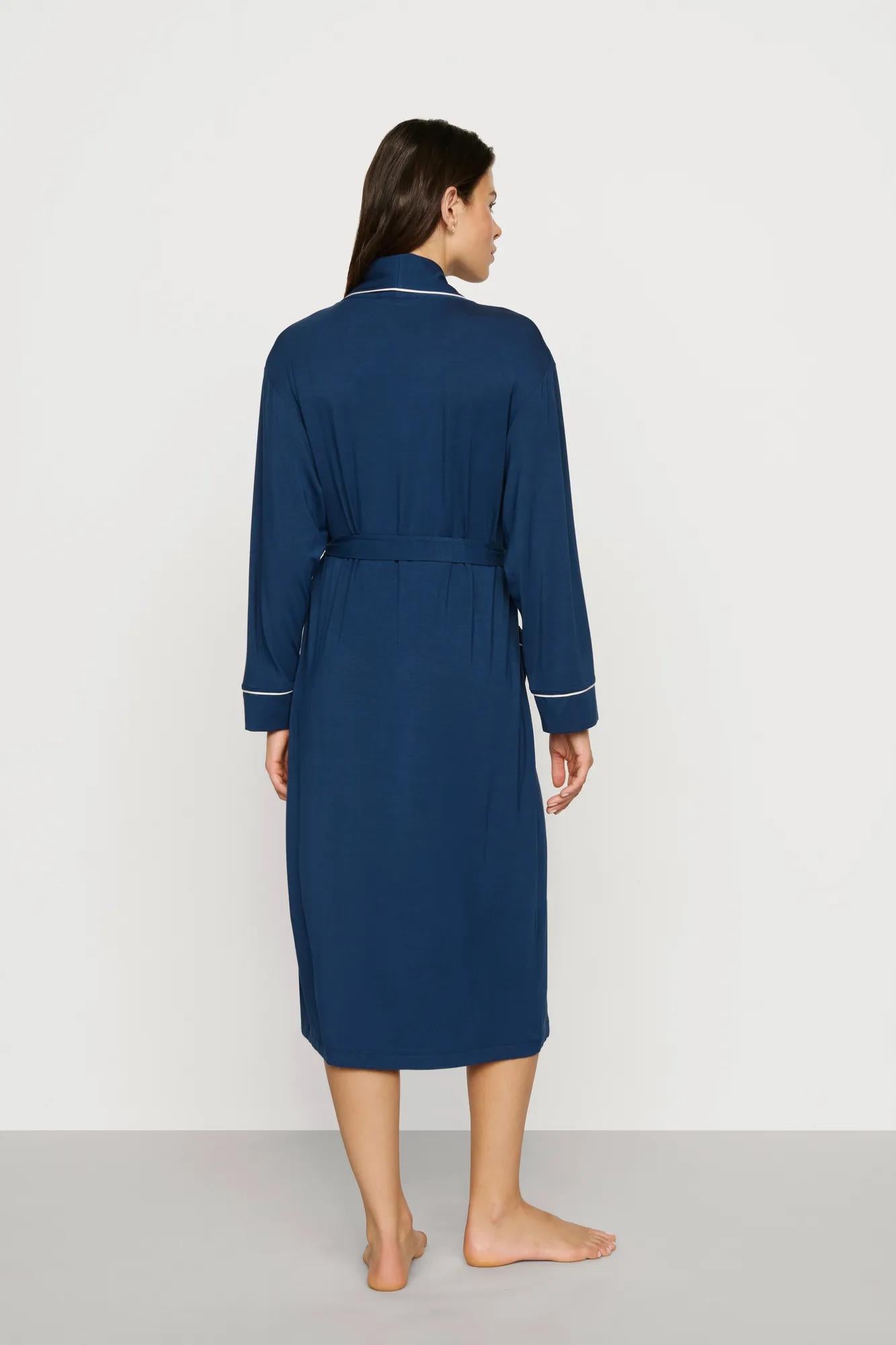 Model is wearing Gisele TENCEL™ Modal Long Robe in Navy/Ivory