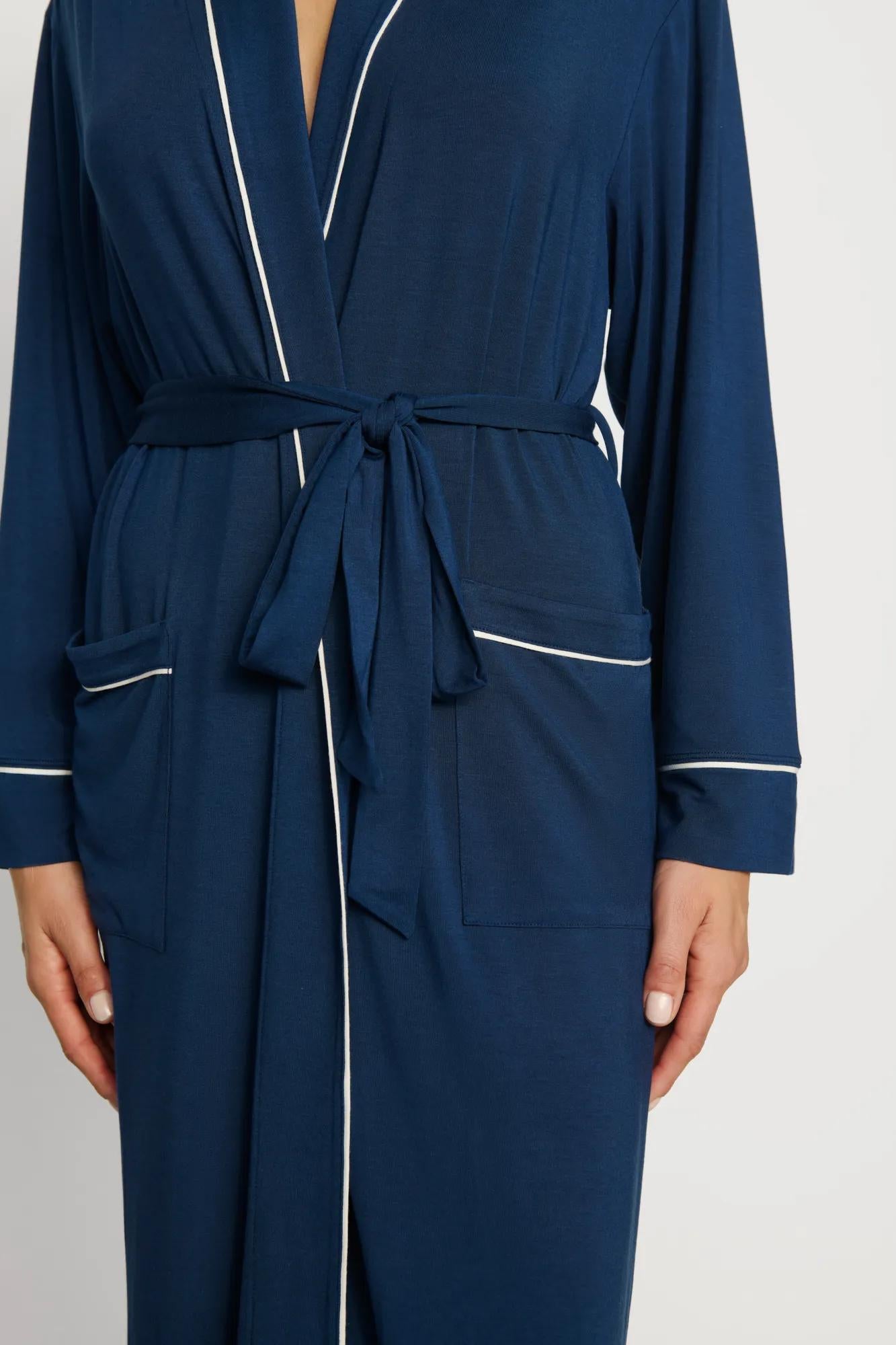 Model is wearing Gisele TENCEL™ Modal Long Robe in Navy/Ivory