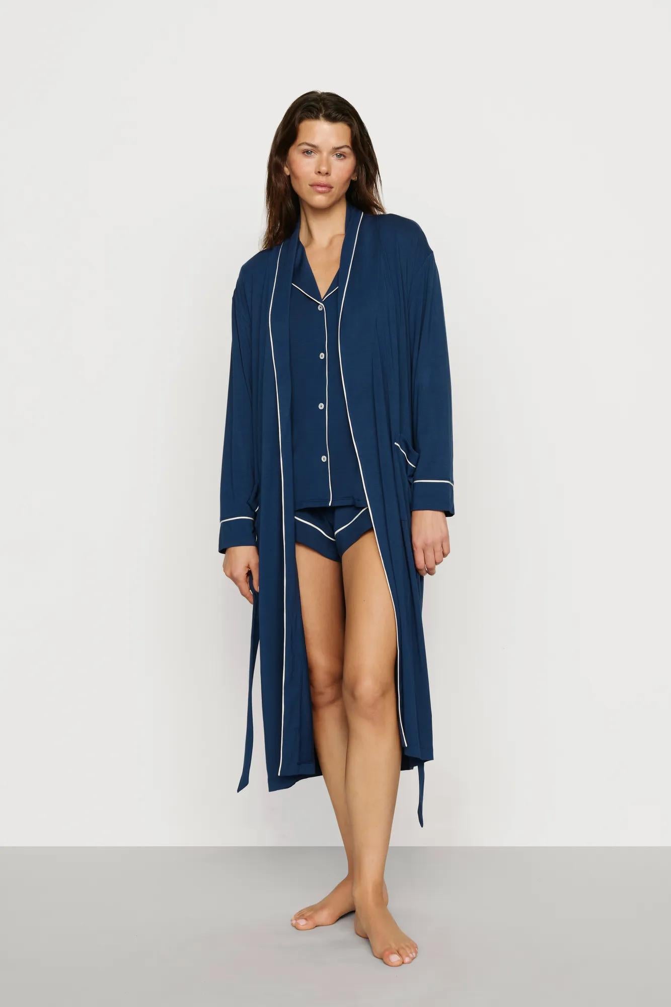 Model is wearing Gisele TENCEL™ Modal Long Robe in Navy/Ivory