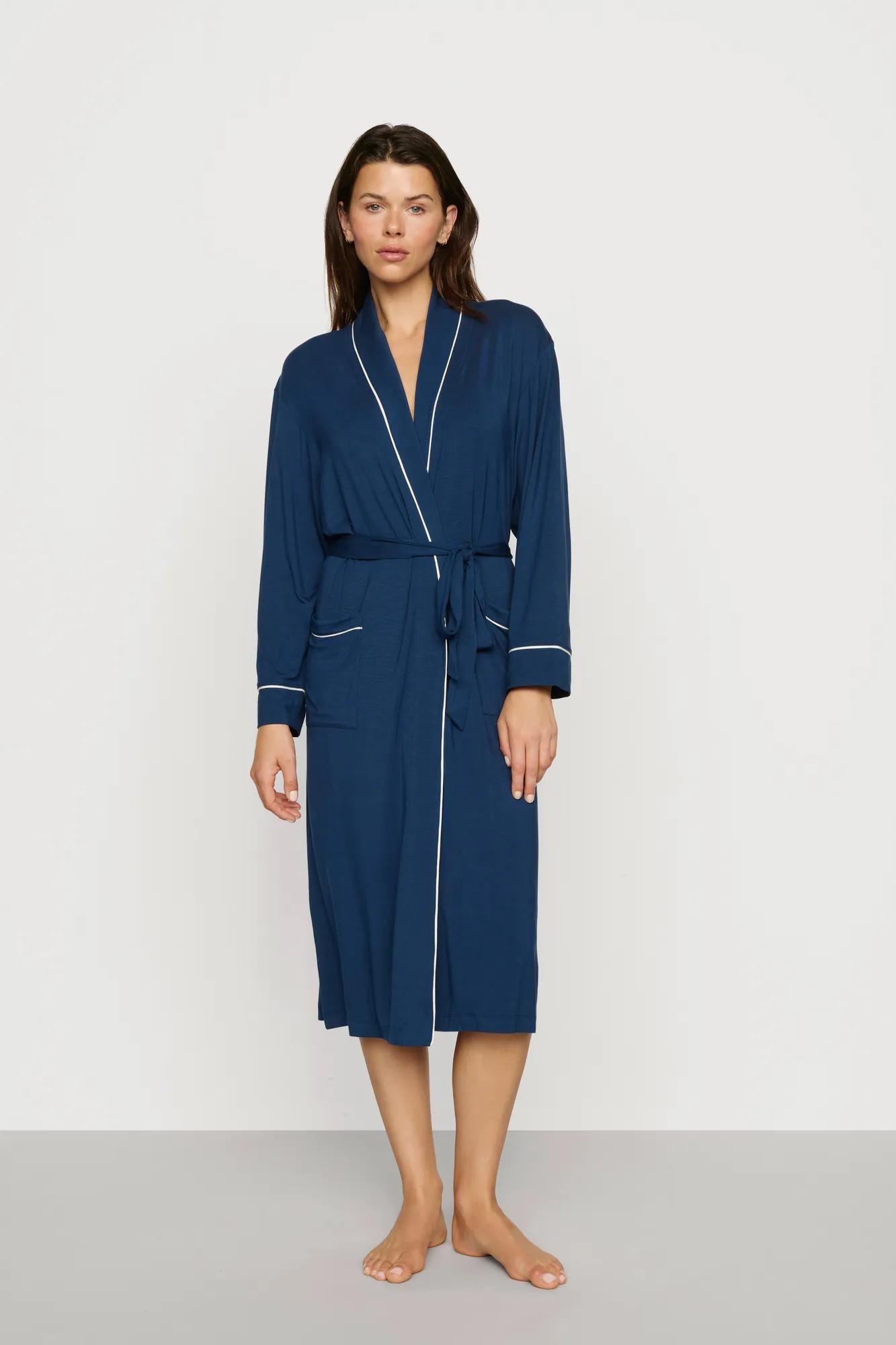 Model is wearing Gisele TENCEL™ Modal Long Robe in Navy/Ivory