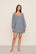 Model is wearing Linen Blend Short Dress in Gingham White/Navy