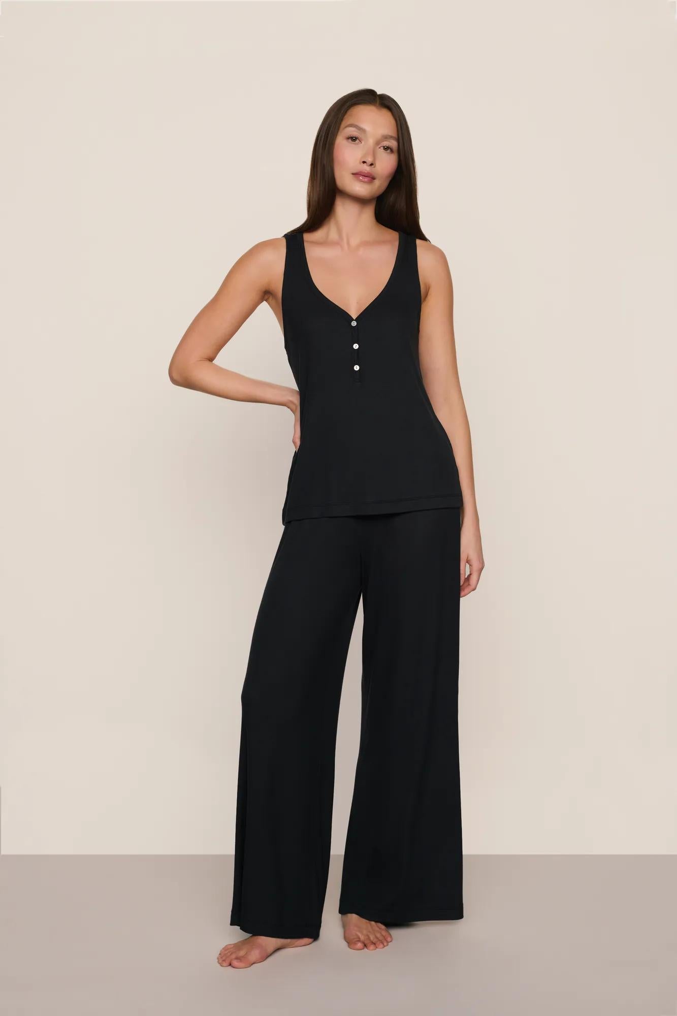 Model is wearing Dream Rib V Neck Tank in Black