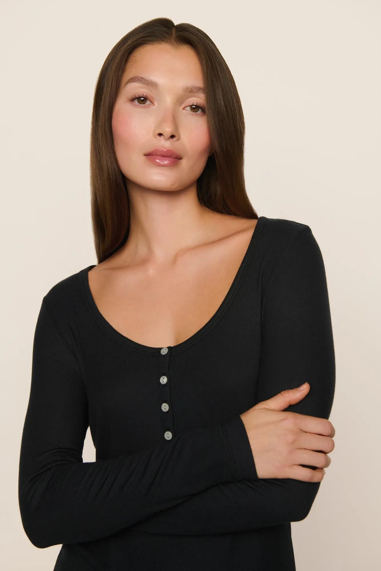 Model is wearing Dream Rib Long Sleeve Henley Tee in Black