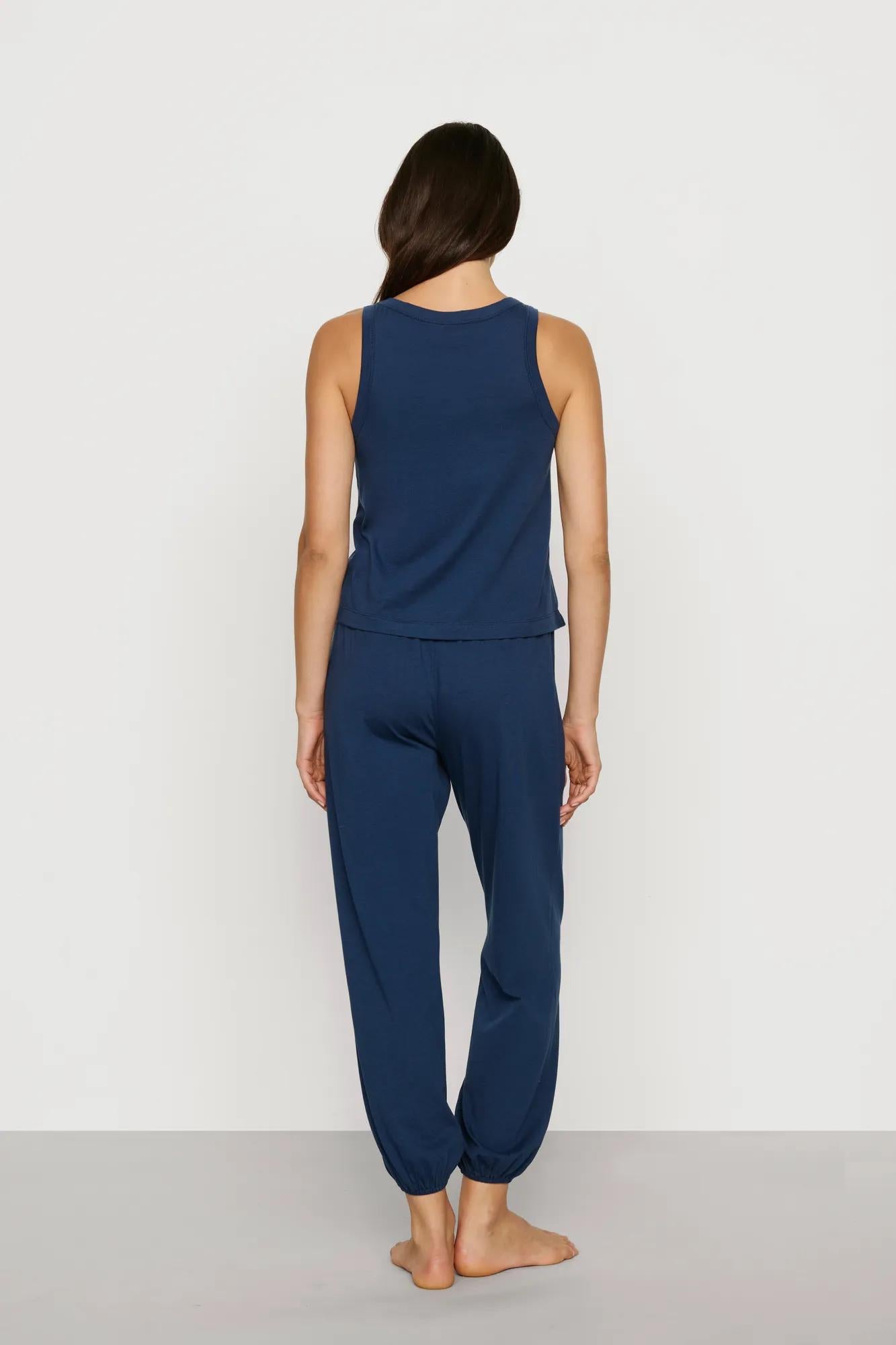 Model is wearing Aloe Cotton Tank in Navy