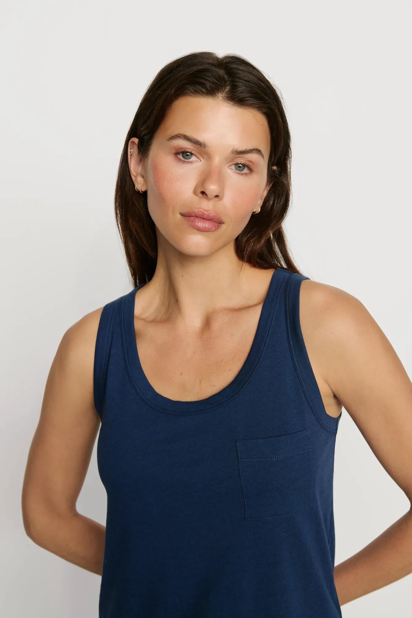 Model is wearing Aloe Cotton Tank in Navy