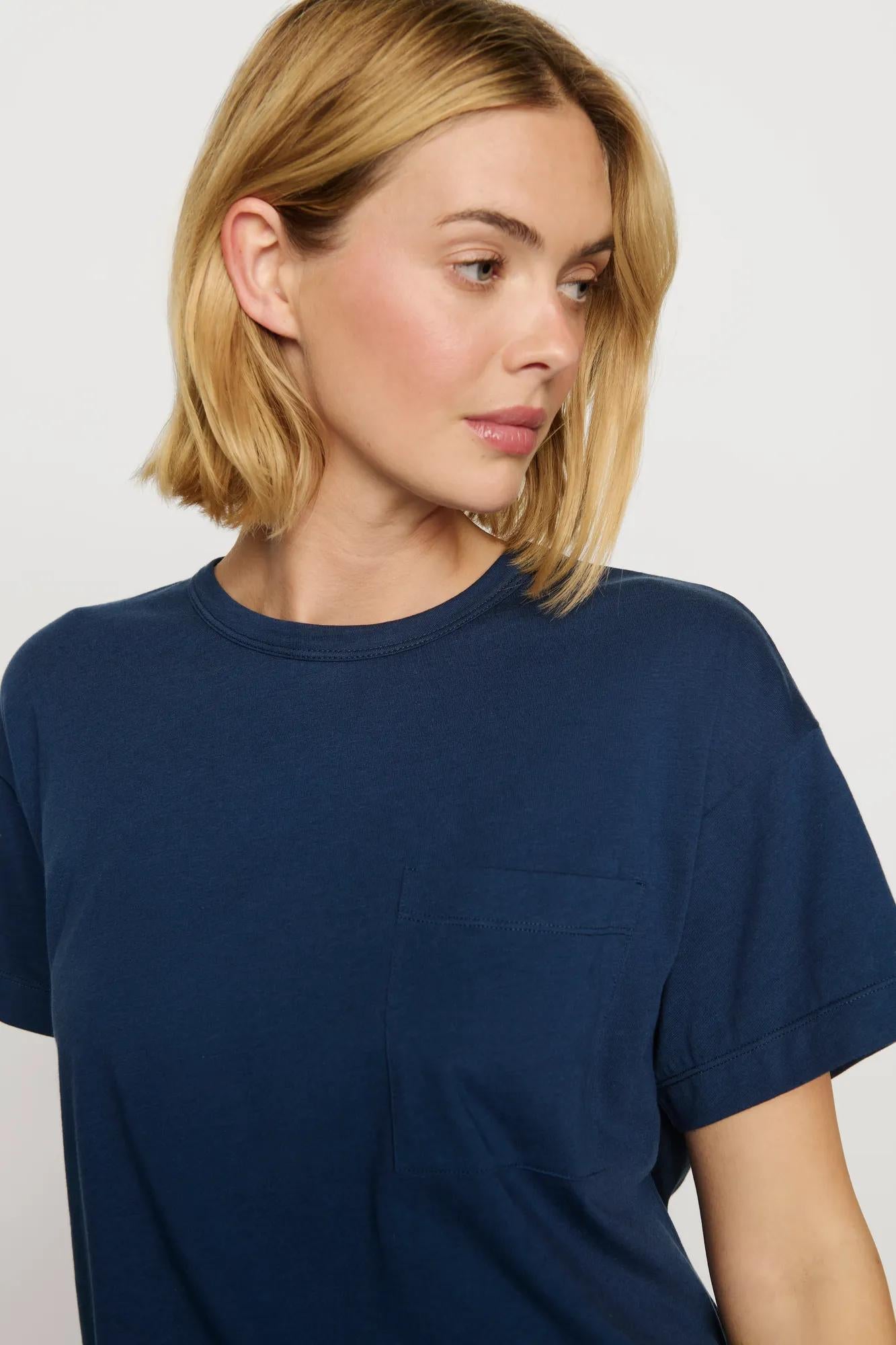Model is wearing Aloe Cotton Short Sleeve Tee in Navy