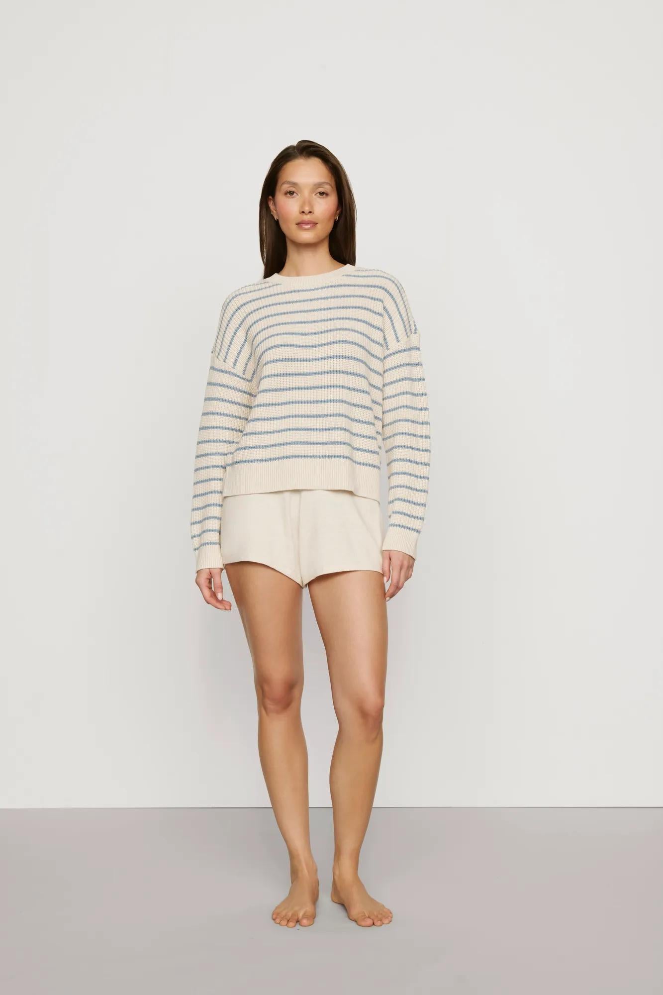 Model is wearing Coastal Cotton Sweater Polo in Regatta Stripe Summer Blue/Whi