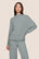 Model is wearing Cozy Time Mock Neck Pullover  in Lead