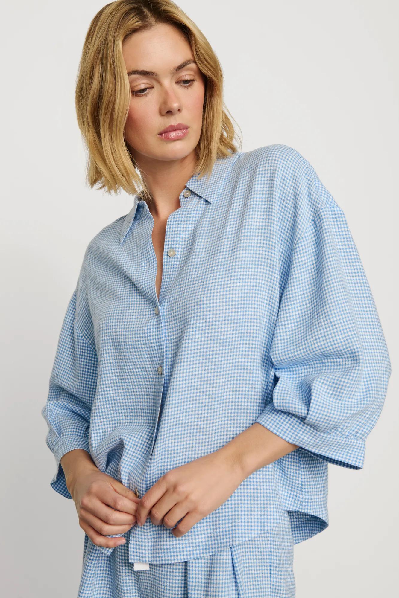 Model is wearing Linen Blend Relaxed Quarter Sleeve Top in Gingham White/Summer Blue