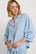 Model is wearing Linen Blend Relaxed Quarter Sleeve Top in Gingham White/Summer Blue